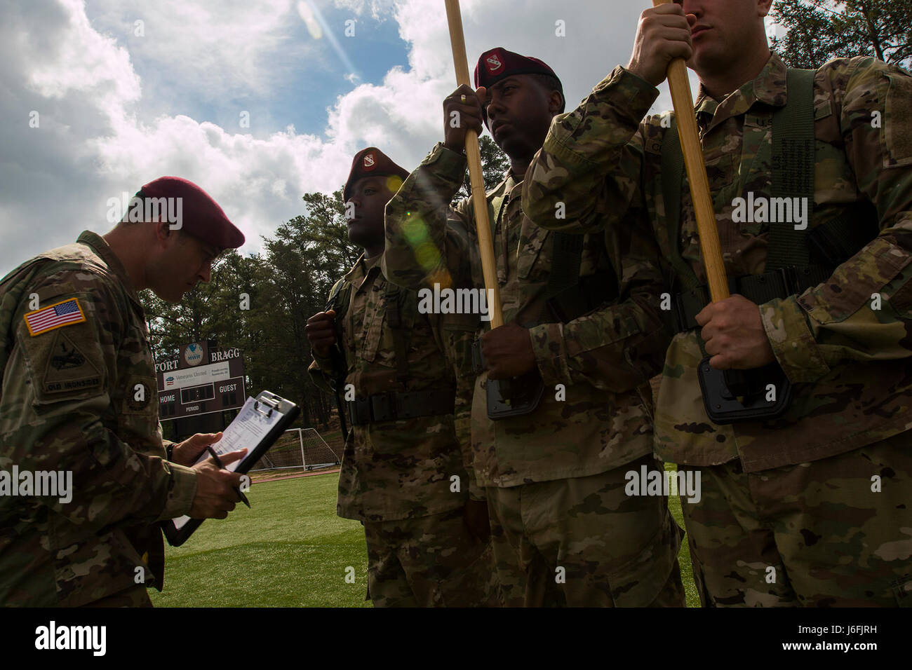 Paratroopers of the Headquarters and Headquarters Battery, 82nd Division Artillery, 82nd Airborne Division stand in formation for a Task-Color Guard inspection during day one of the Color Guard and Guidon Competition at Towle Stadium on Fort Bragg, N.C., May 18, 2017. The Division's legacy as 'America's Guard of Honor' is traced back to the American color guard in Berlin after World War II. In honor of the proud history of the 82nd, we continue to carry on the tradition of Paratroopers past and present. (U.S. Army photo by Spc. L'Erin Wynn) Stock Photo