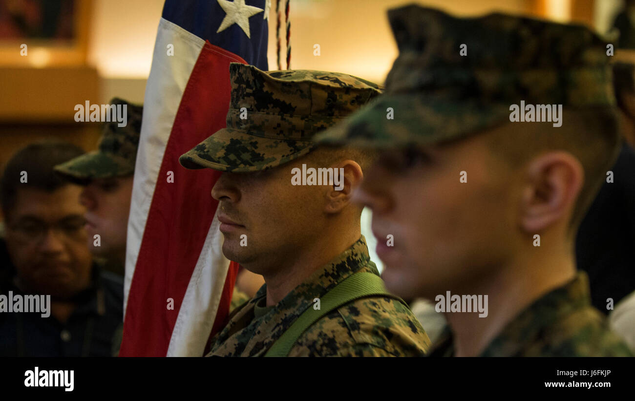 U.S. Marine color guard retire the national flag during the closing ceremony of Balikatan 2017 at Camp Aguinaldo, Quezon City, May 19, 2017. Balikatan is an annual U.S.-Philippine bilateral military exercise focused on a variety of missions, including humanitarian assistance and disaster relief, counterterrorism, and other combined military operations. (U.S. Navy photo by Mass Communication Specialist 2nd Class Markus Castaneda) Stock Photo