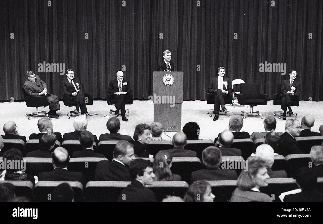 THERE IS A MAN AT THE PODIUM GIVING A SPEECH TO A GROUP OF MEN AND ...