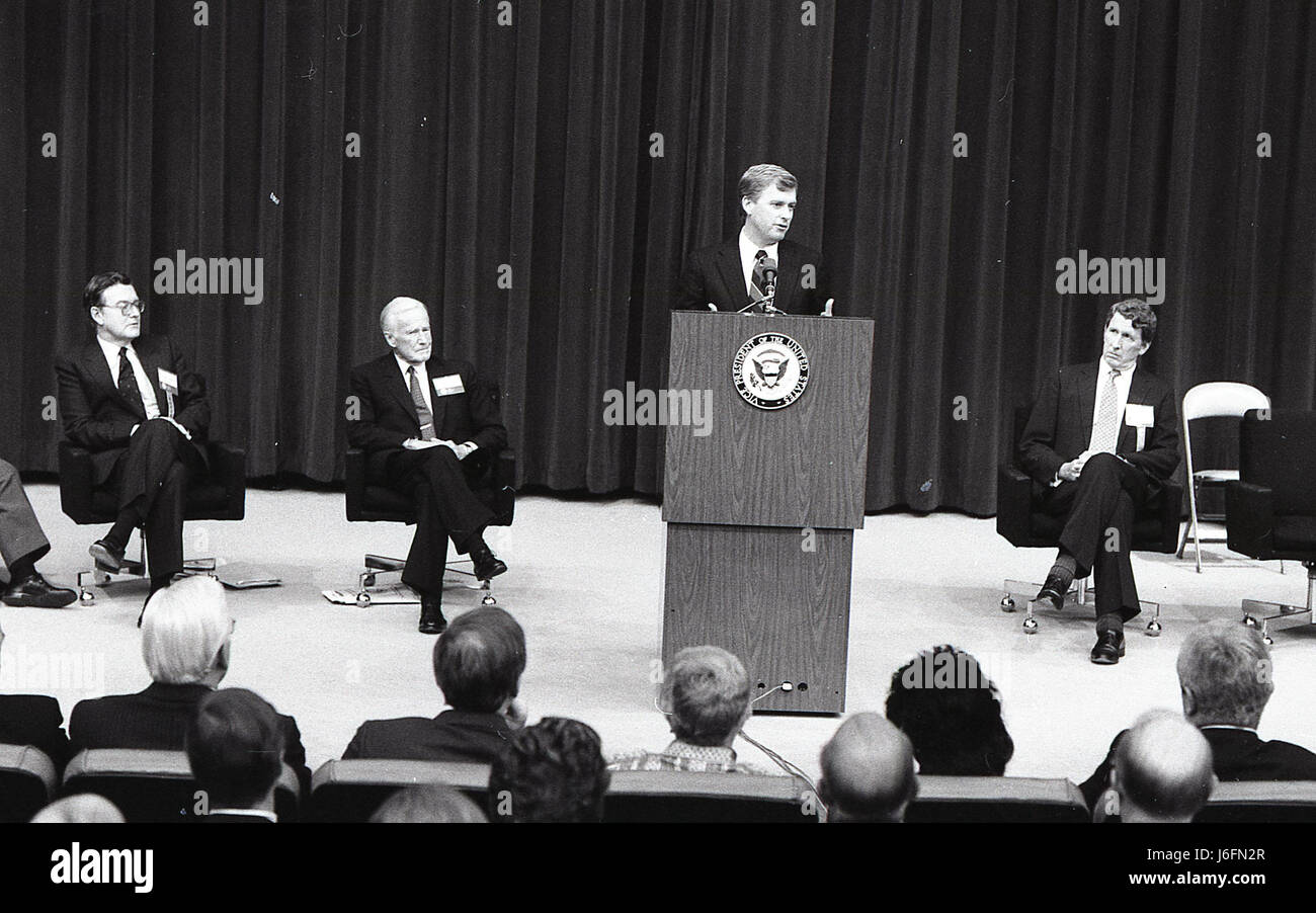 THERE IS A MAN AT THE PODIUM GIVING A SPEECH TO A GROUP OF MEN AND ...