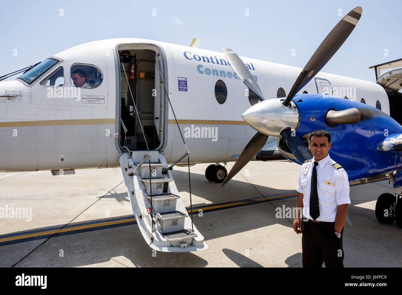 Florida Pensacola,Pensacola Regional Airport,Continental Airlines,Connection,commuter flight,aircraft,tarmac,Asian man men male,co pilot,crew,career,b Stock Photo