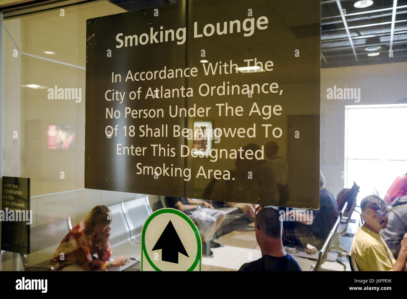 Atlanta Georgia,Hartsfield Jackson Atlanta International Airport,smoking lounge,vice,addiction,restriction,warning sign,underage,designated area,secon Stock Photo