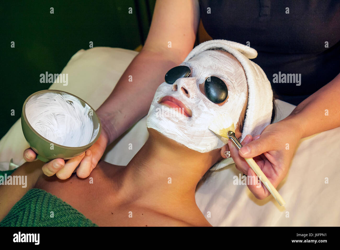Sevierville Tennessee,Smoky Mountains,The Spa at Oak Haven,woman female women,client,esthetician,technique,relax,hot stone facial,creamy mask,skincare Stock Photo
