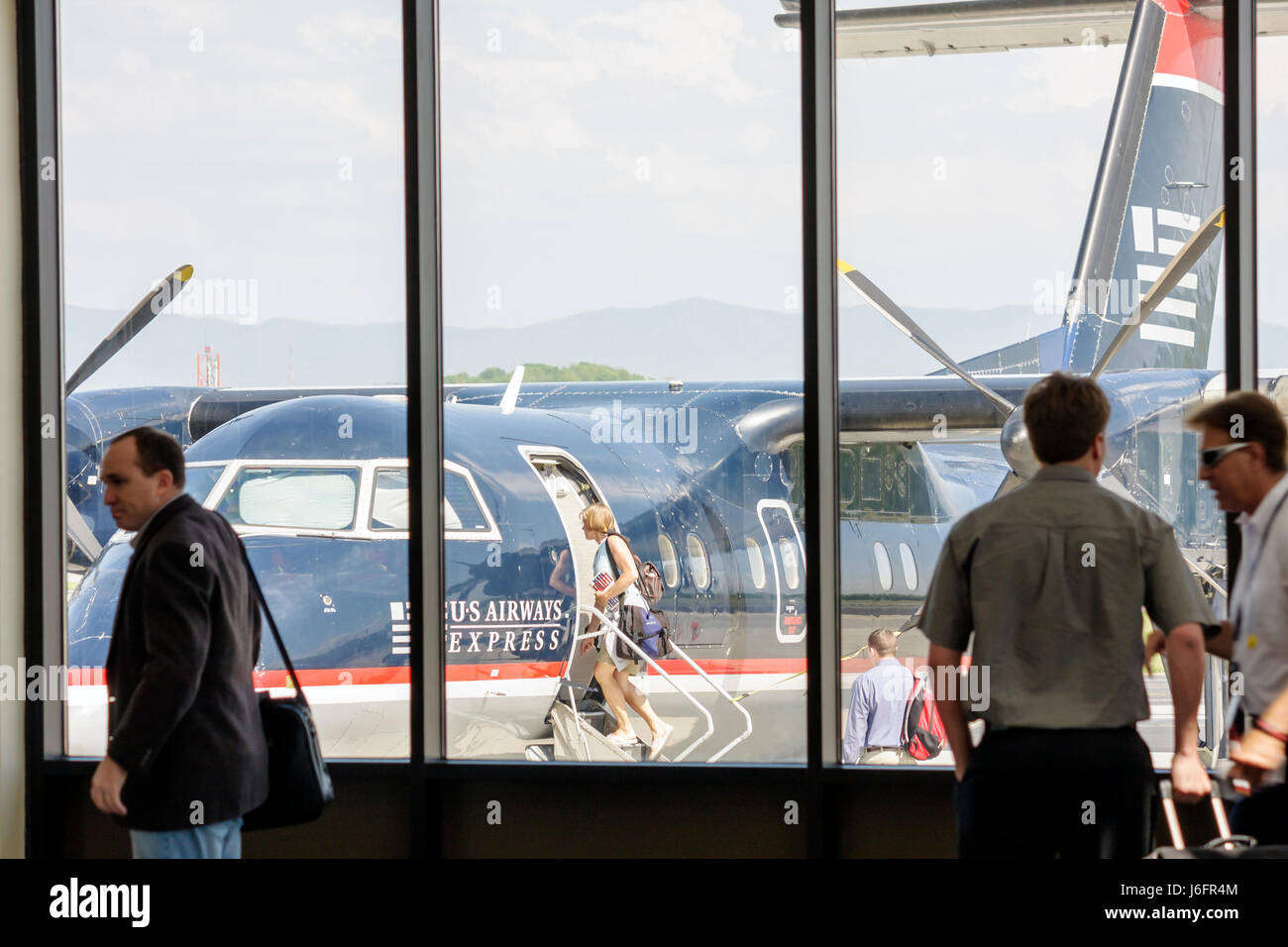 Tennessee Blountville,Tri City Airport,US Airways Express,regional airliner,plane,commuter flight,plane,adult adults woman women female lady,men,board Stock Photo
