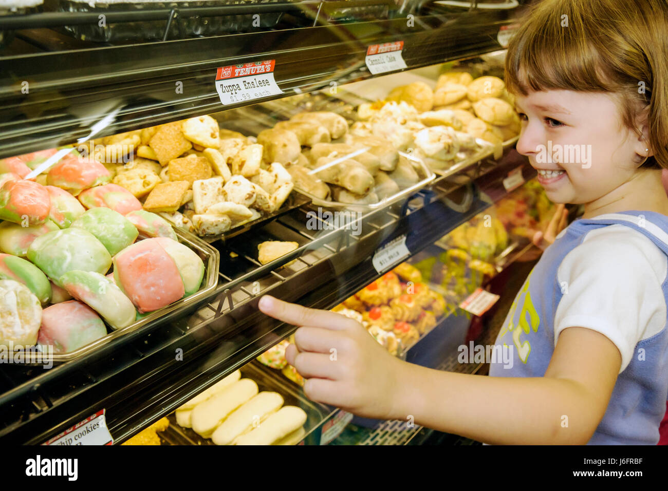 Kenosha Wisconsin,Tenuta's Delicatessen Liquors and Wines,girl girls,youngster youngsters youth youths female kid kids child children,tray,food,bakery Stock Photo