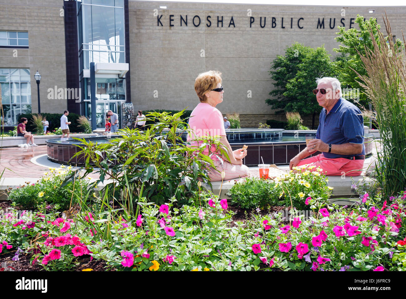 Wisconsin Kenosha County,Kenosha,Kenosha Public Museum,man men male,woman female women,couple,picnic,flower,flower,garden,plaza,summer,WI080712018 Stock Photo
