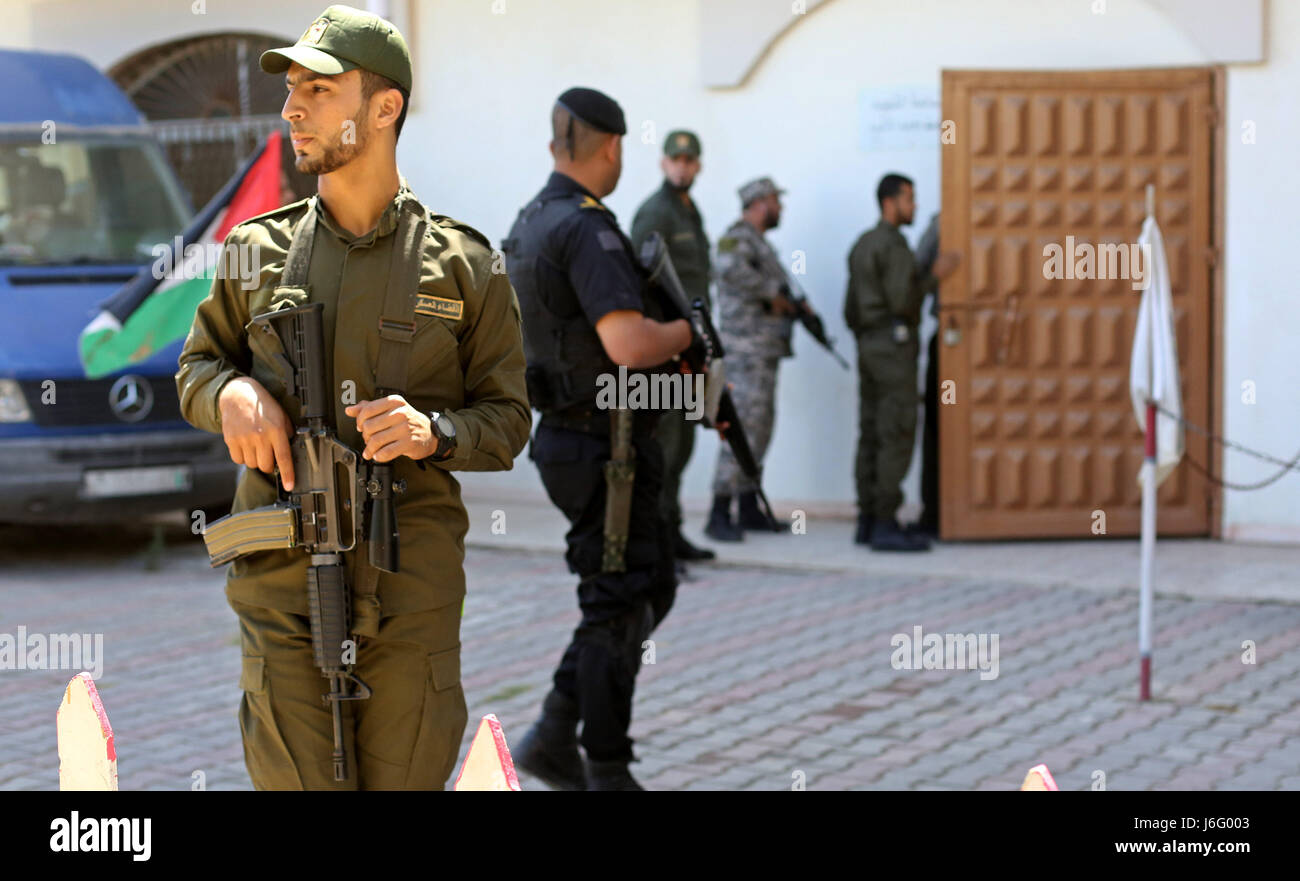 Gaza City, Gaza Strip, Palestinian Territory. 20th May, 2017. Palestinian Security forces stand guard, out of the military court in Gaza City May 21, 2017. A court in the Gaza Strip sentenced three men to death over the assassination of a Hamas military commander that the Islamist movement accused Israel of masterminding Credit: Ashraf Amra/APA Images/ZUMA Wire/Alamy Live News Stock Photo