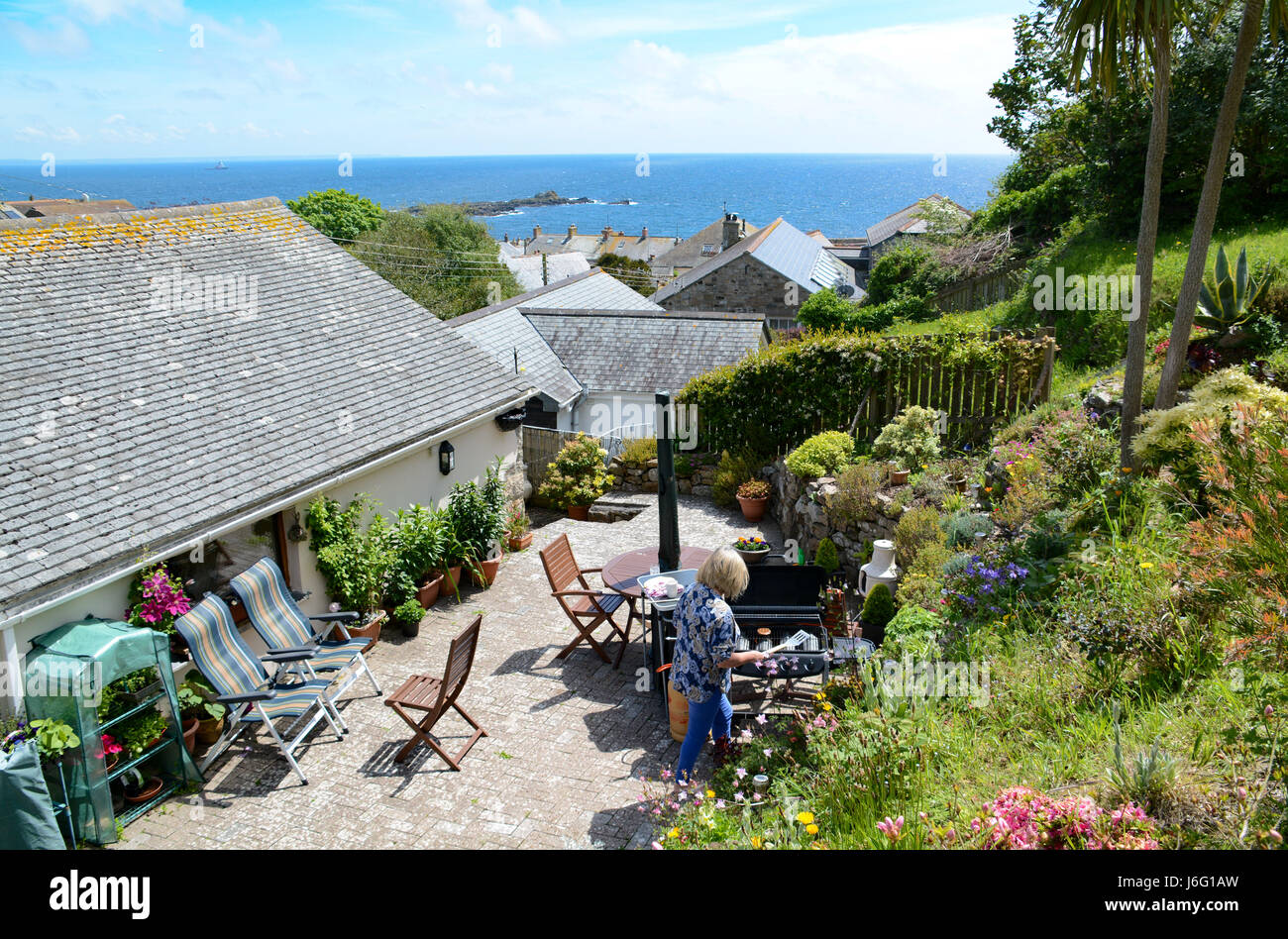 Mousehole, Cornwall, UK. 21st May, 2017. UK Weather. Ideal weather for an afternoon barbecue followed by sunbathing in south west Cornwall today. Credit: cwallpix/Alamy Live News Stock Photo