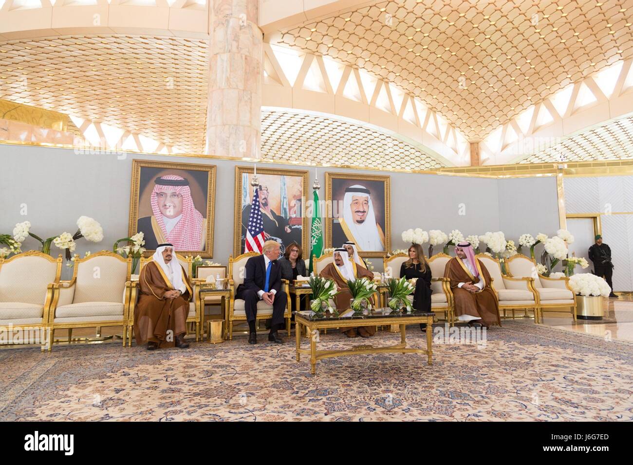 U.S. President Donald Trump chats with Saudi King Salman bin Abdulaziz Al Saud as First Lady Melania Trump looks on during a ceremonial welcoming tea after arriving at King Khalid International Airport May 20, 2017 in Riyadh, Saudi Arabia. Stock Photo