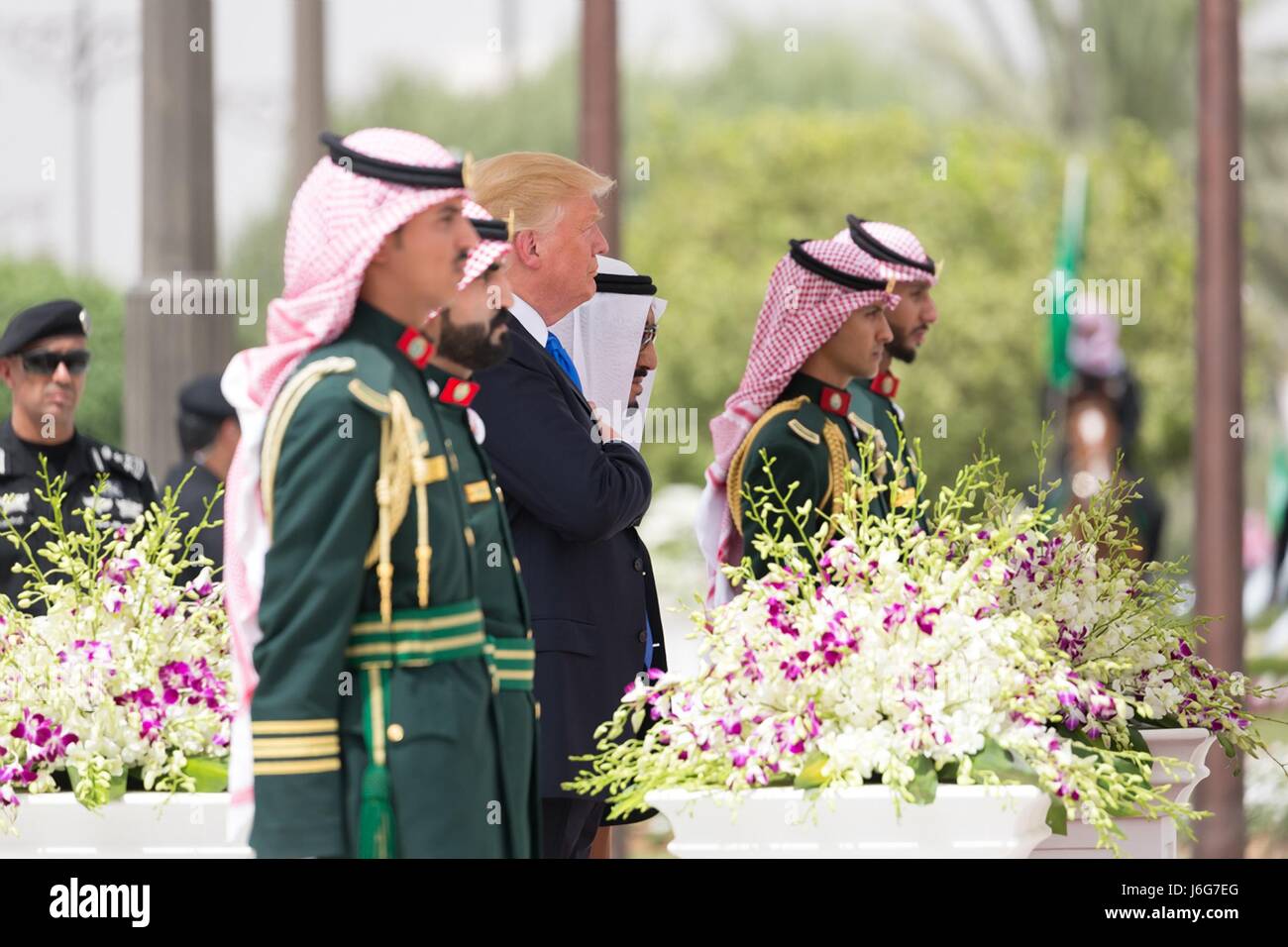 U.S. President Donald Trump stands with Saudi King Salman bin Abdulaziz Al Saud during arrival ceremonies at King Khalid International Airport May 20, 2017 in Riyadh, Saudi Arabia. Stock Photo