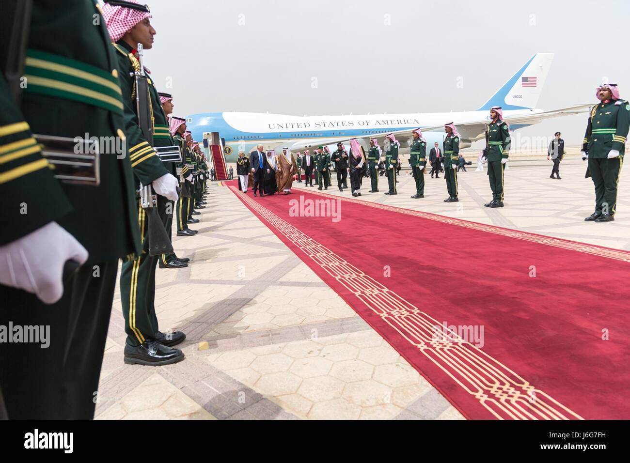 U.S. President Donald Trump is escorted by Saudi King Salman bin Abdulaziz Al Saud during arrival ceremonies at King Khalid International Airport May 20, 2017 in Riyadh, Saudi Arabia. Stock Photo