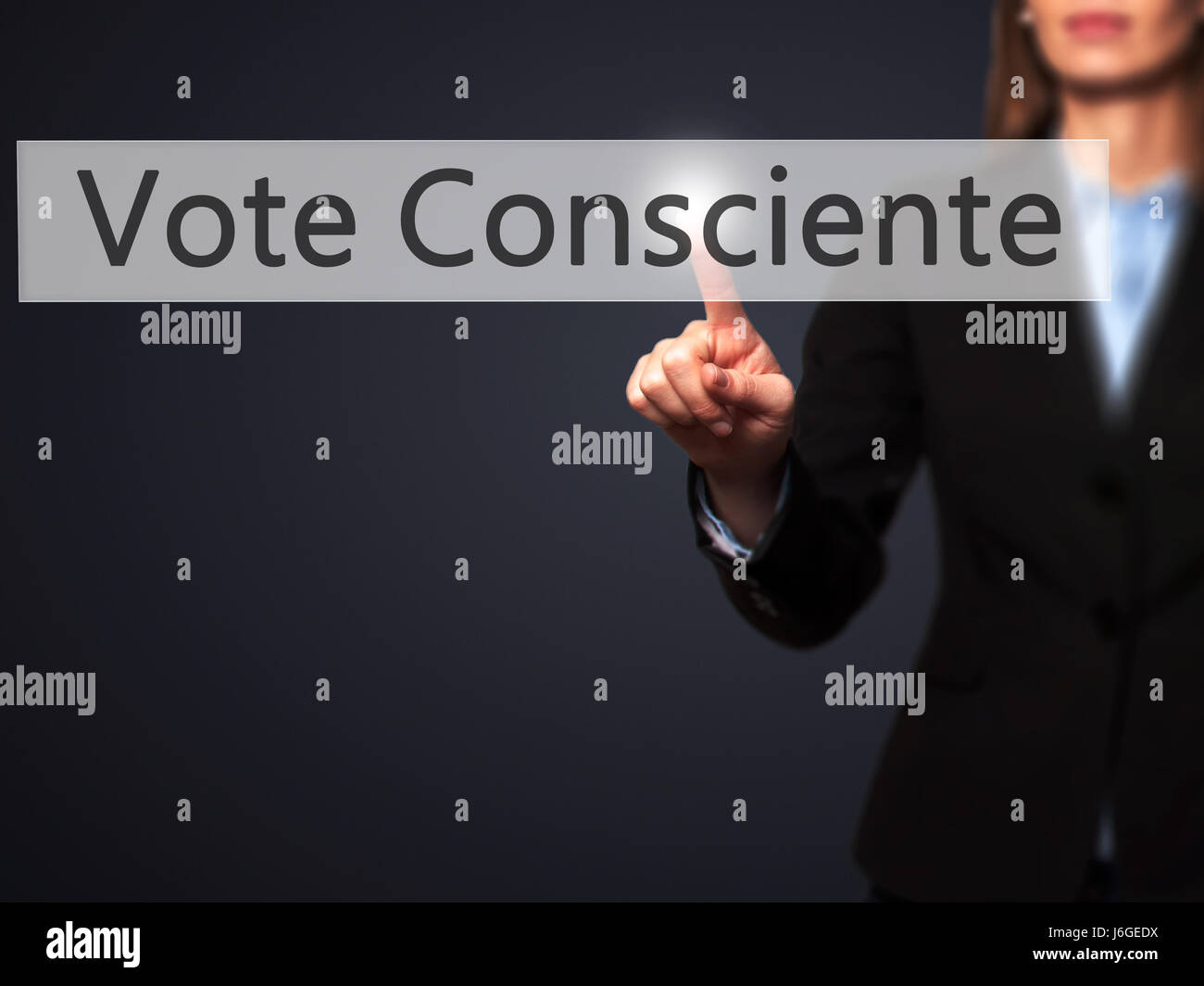 Vote Consciente - Businesswoman hand pressing button on touch screen interface. Business, technology, internet concept. Stock Photo Stock Photo