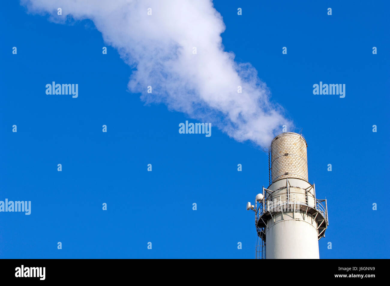 steaming,smoking chimney Stock Photo