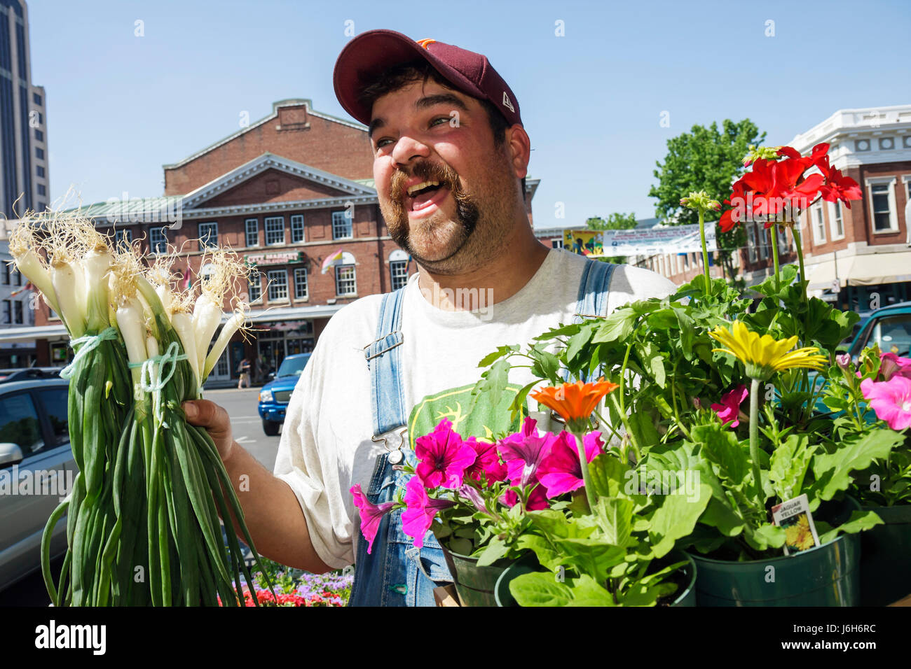 Roanoke Virginia,Market Square,Farmers' Market,man men male adult adults,local produce,vegetable,vegetables,flower,flower,plants,overalls,country,scal Stock Photo