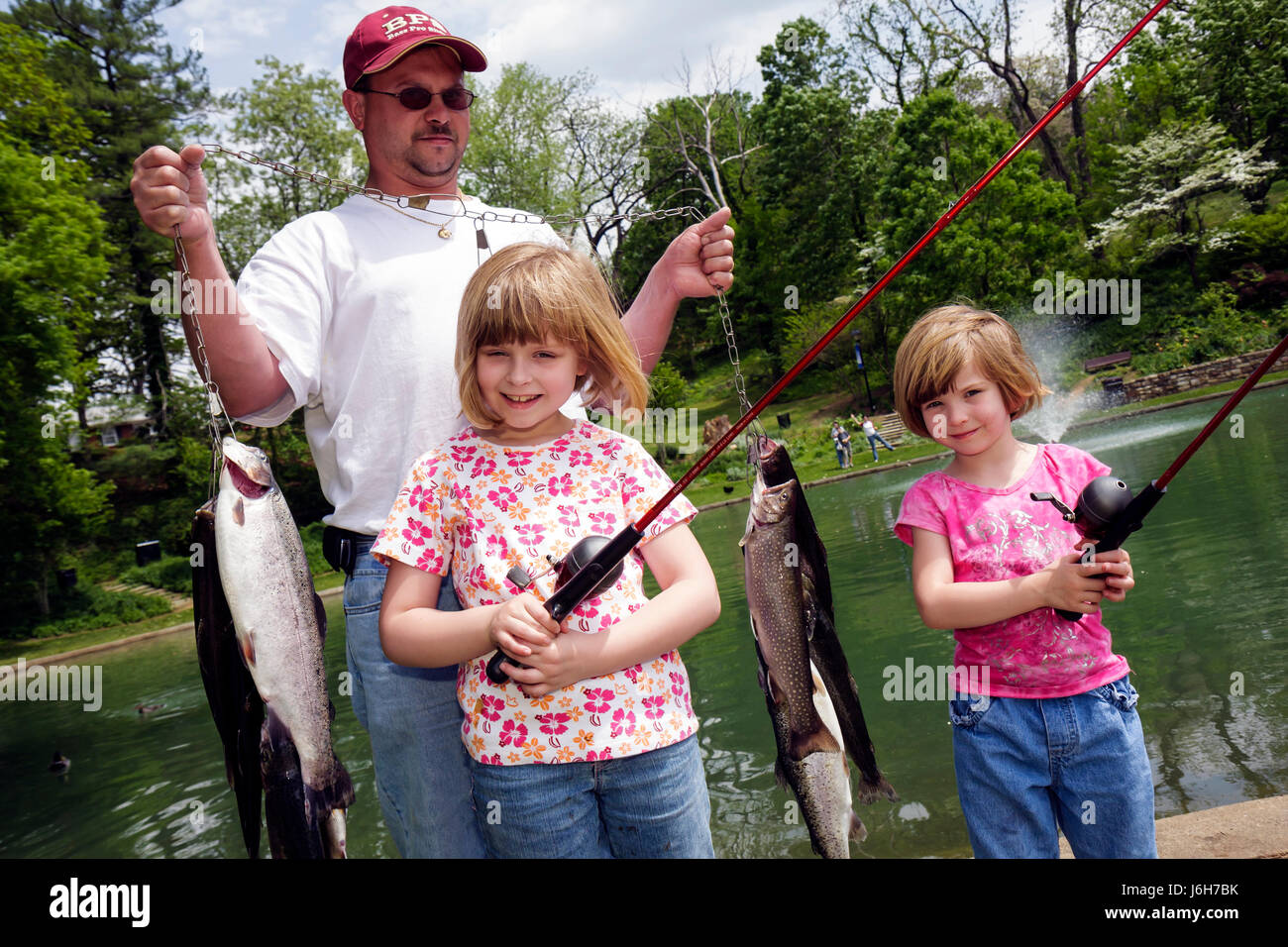 Fishing poles group of people hi-res stock photography and images