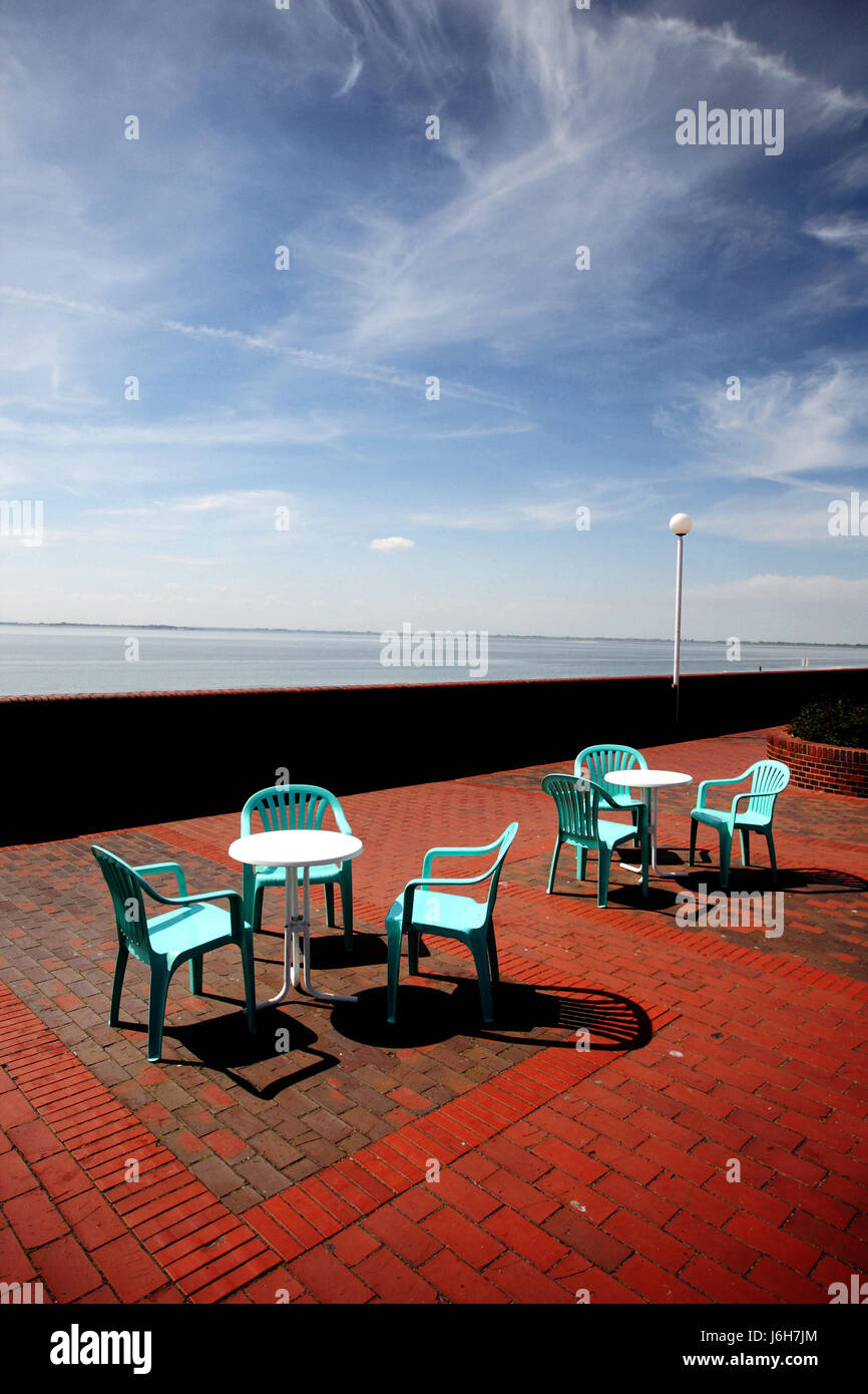 chairs seat firmament sky salt water sea ocean water table shaddow shadow Stock Photo