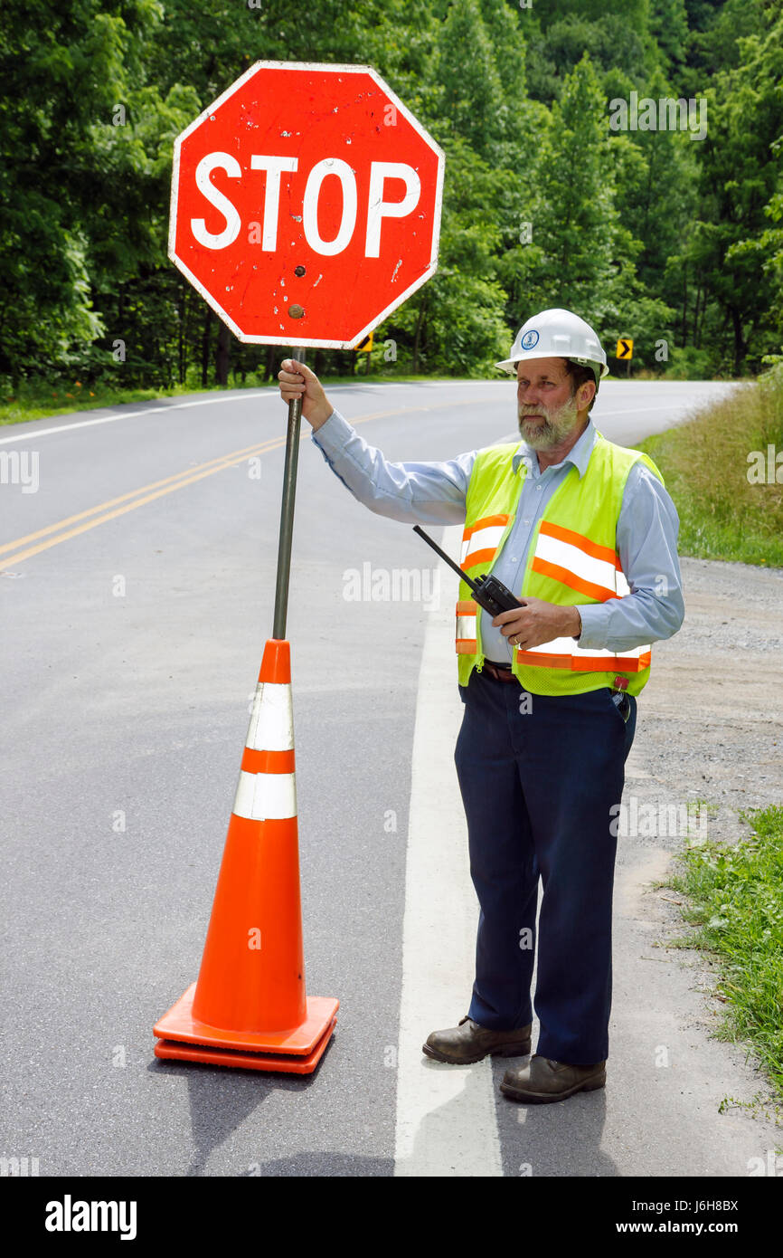 Virginia Lynchburg,highway Route 501,stop sign,under new construction site building builder,crew,man men male,reflective safety vest,traffic delay,sin Stock Photo