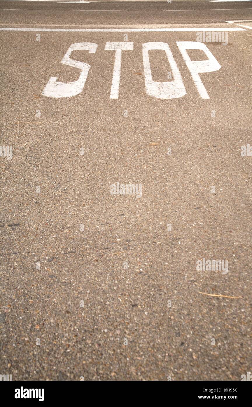 sign signal traffic transportation asphalt paint stop stops text aborting road Stock Photo