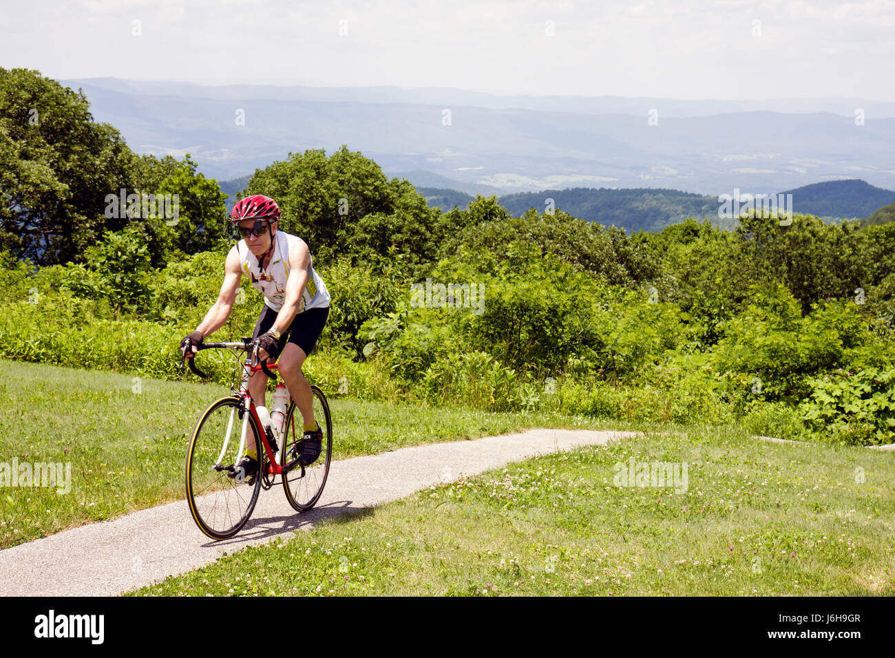 Blue Ridge Parkway Virginia,Appalachian Mountains,Sunset Field Overlook,Milepost 79,nature,natural,scenery,adult adults man men male,cyclist,bicycle b Stock Photo