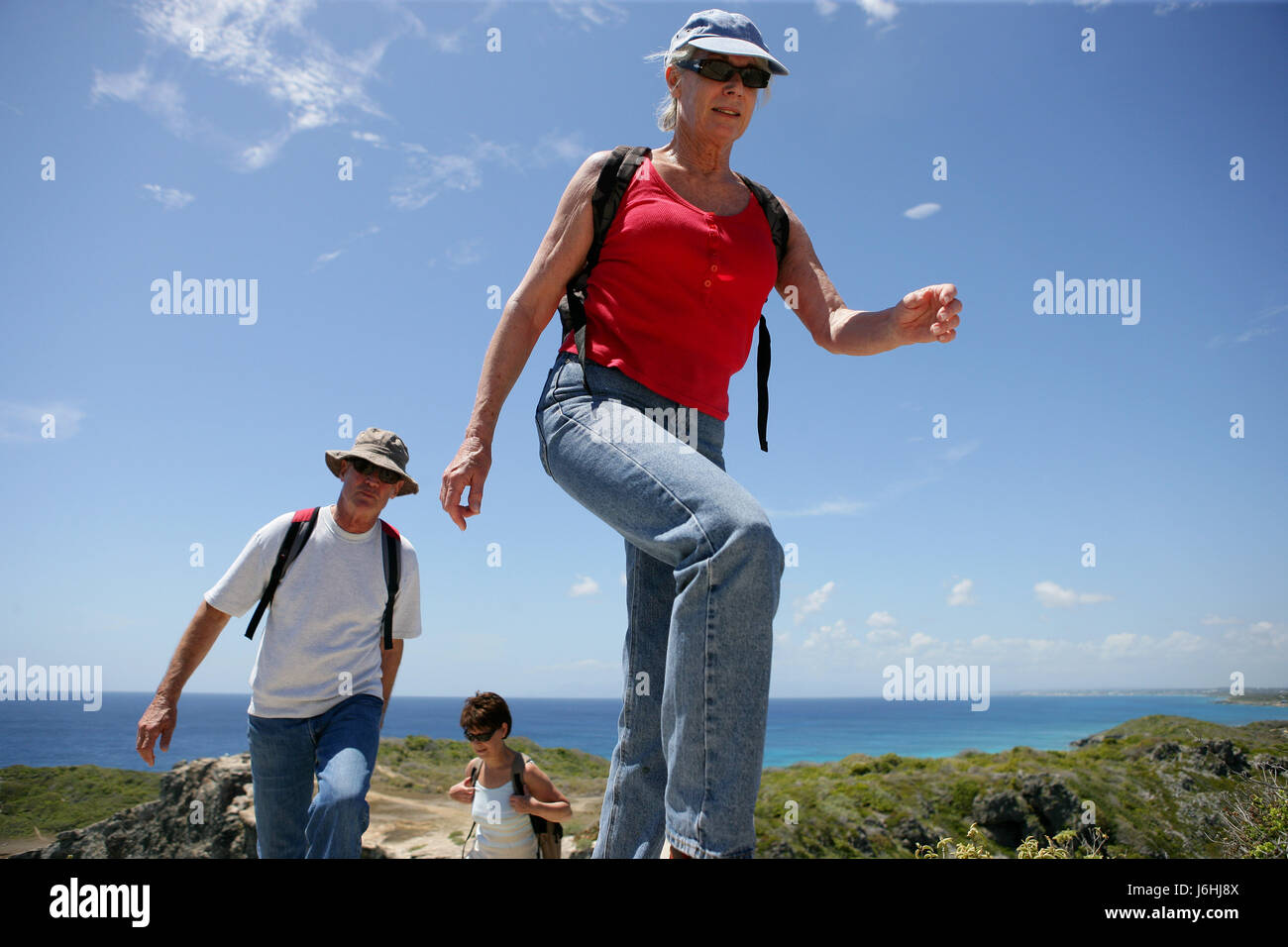 Two hikers walking bicycle hi-res stock photography and images - Alamy
