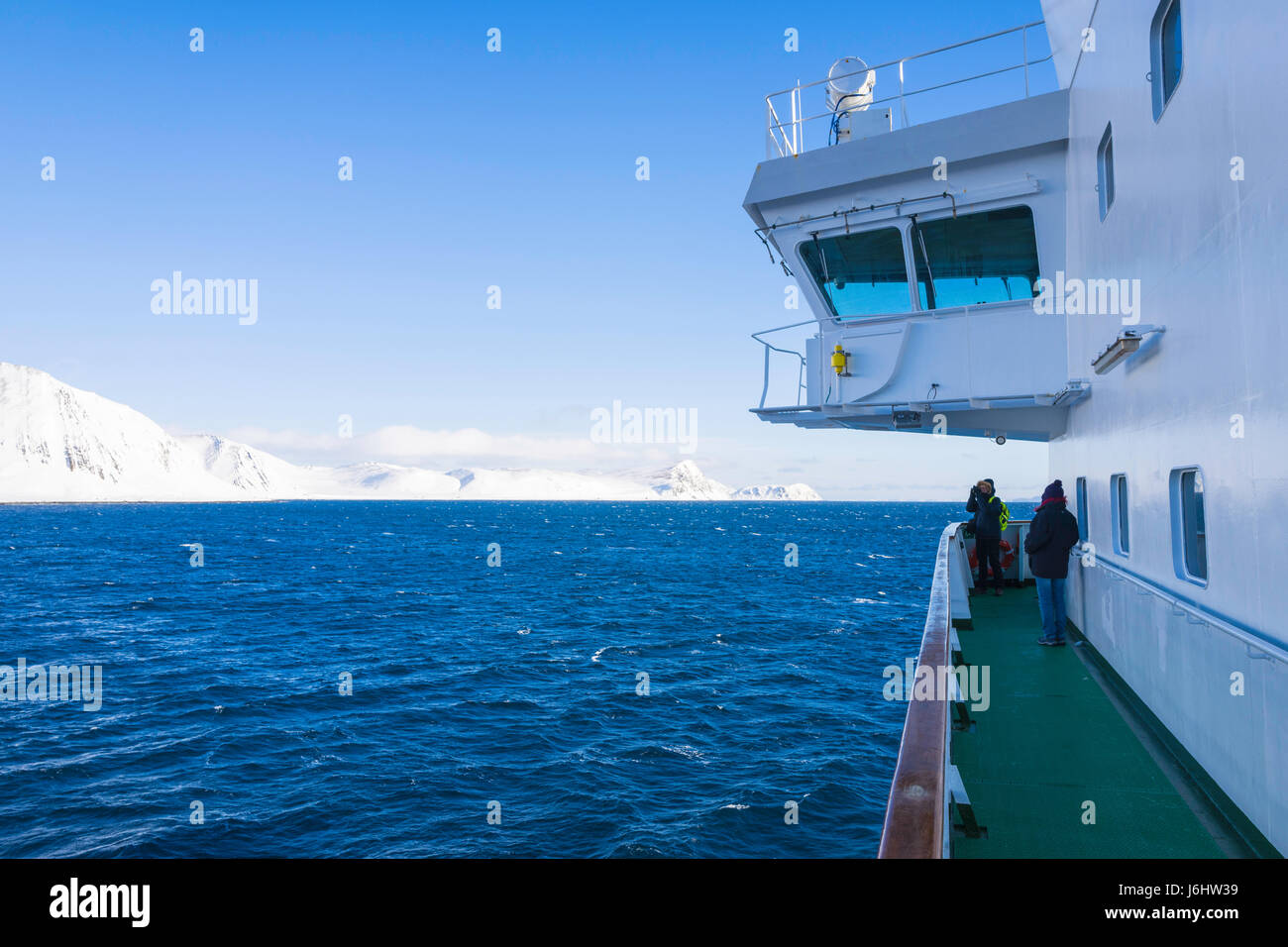 Spectacular mountain scenery seen from a Hurtigruten Coastal Express cruise ship, near Honningsvåg, Norway. Stock Photo