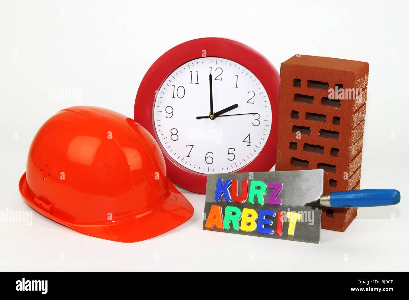 time measurement regulation working time brick trowel short time brick clock Stock Photo