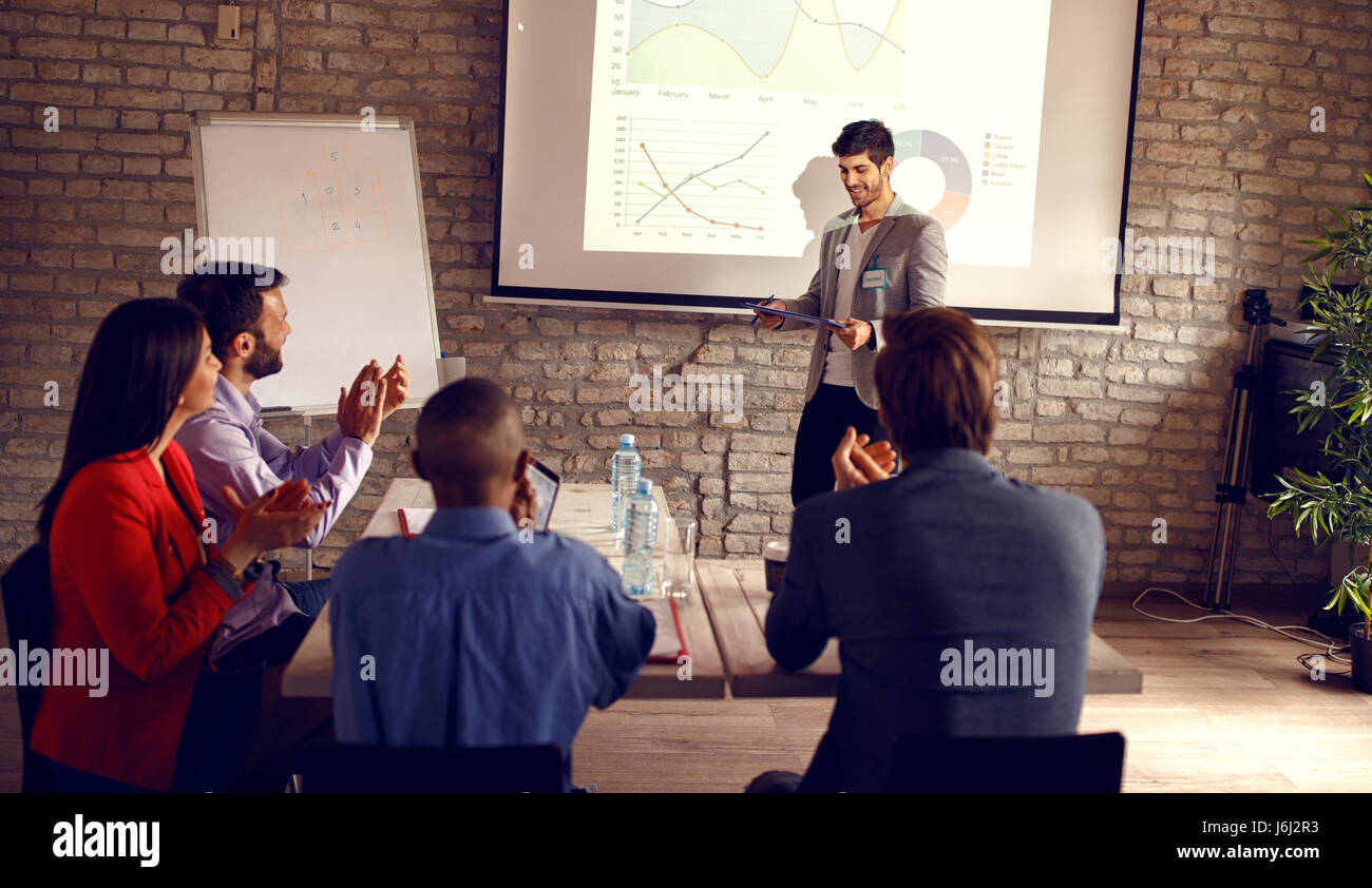 Male holding business presentation about success in business Stock Photo