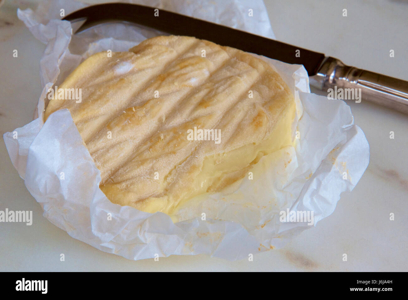 Australian Washed Rind Australian washed rind cheese with a cheese knife Stock Photo - Alamy
