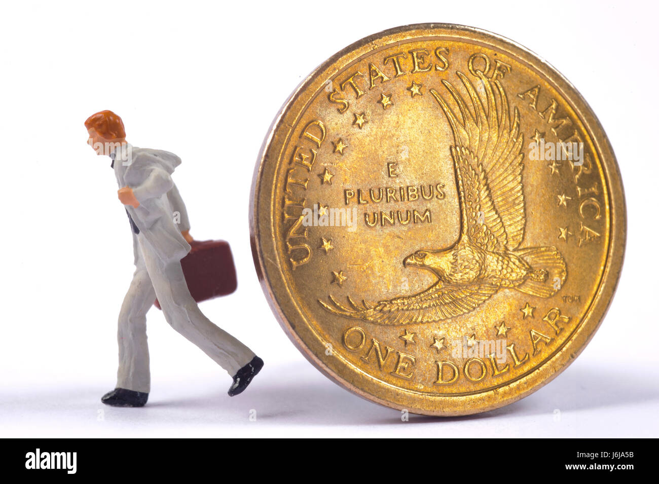 banker is going away from one dollar coin of US currency Stock Photo