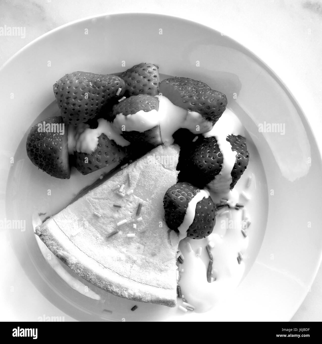 Cheesecake strawberries and cream (black and white) Stock Photo