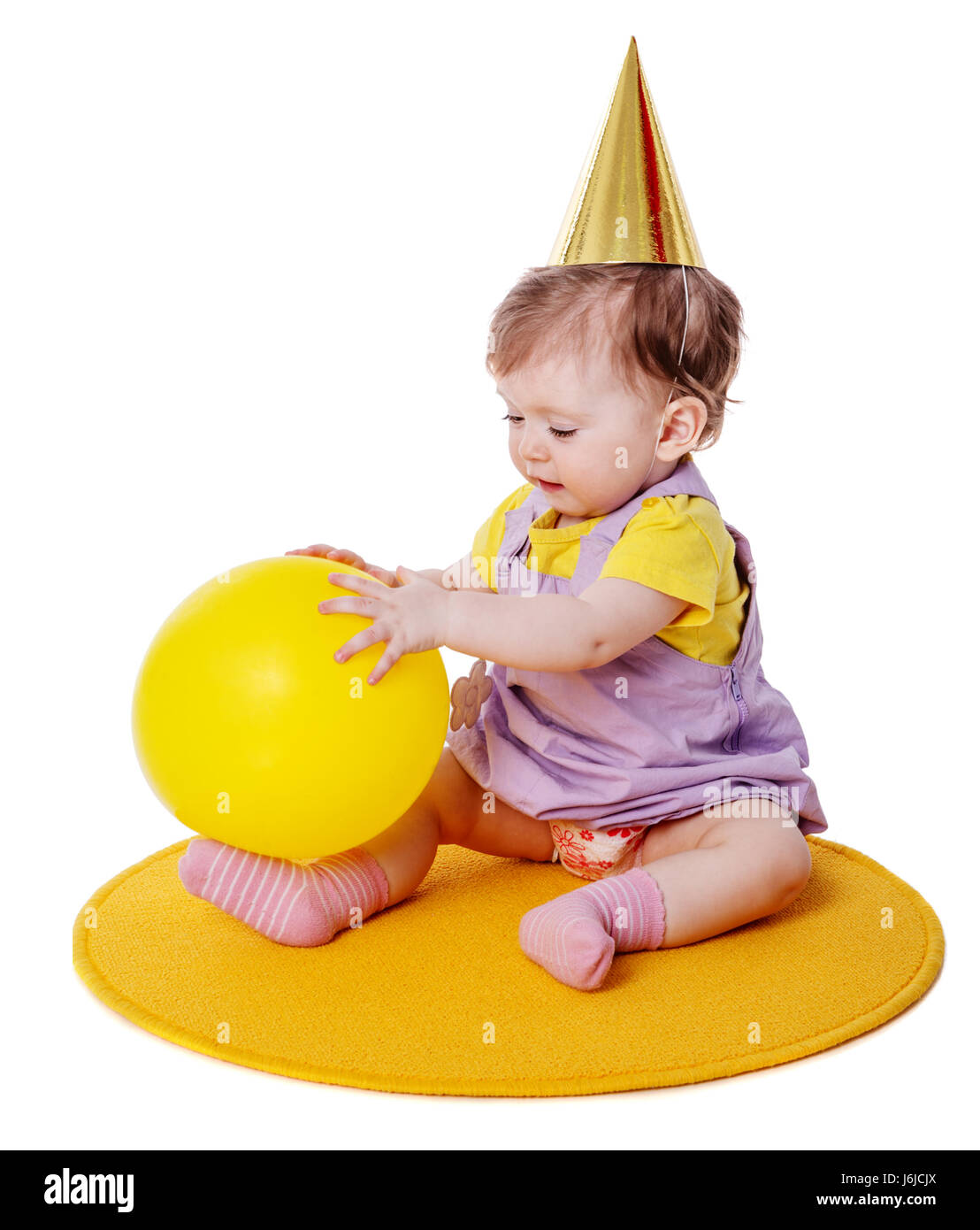 One year baby girl wearing cap holding balloon isolated Stock Photo - Alamy