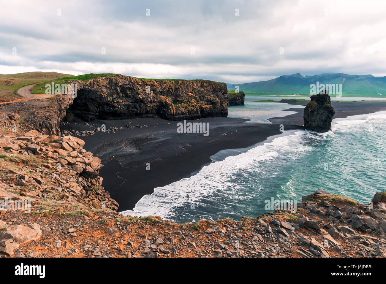 Amazing summer day on Black beach, Reynisdrangar, Vik, Iceland, Europe. Stock Photo