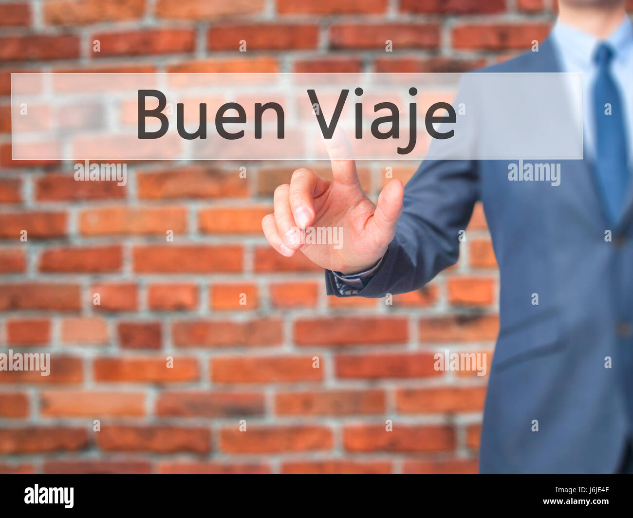 Buen Viaje (Good Trip in Spanish) Businessman hand touch button on