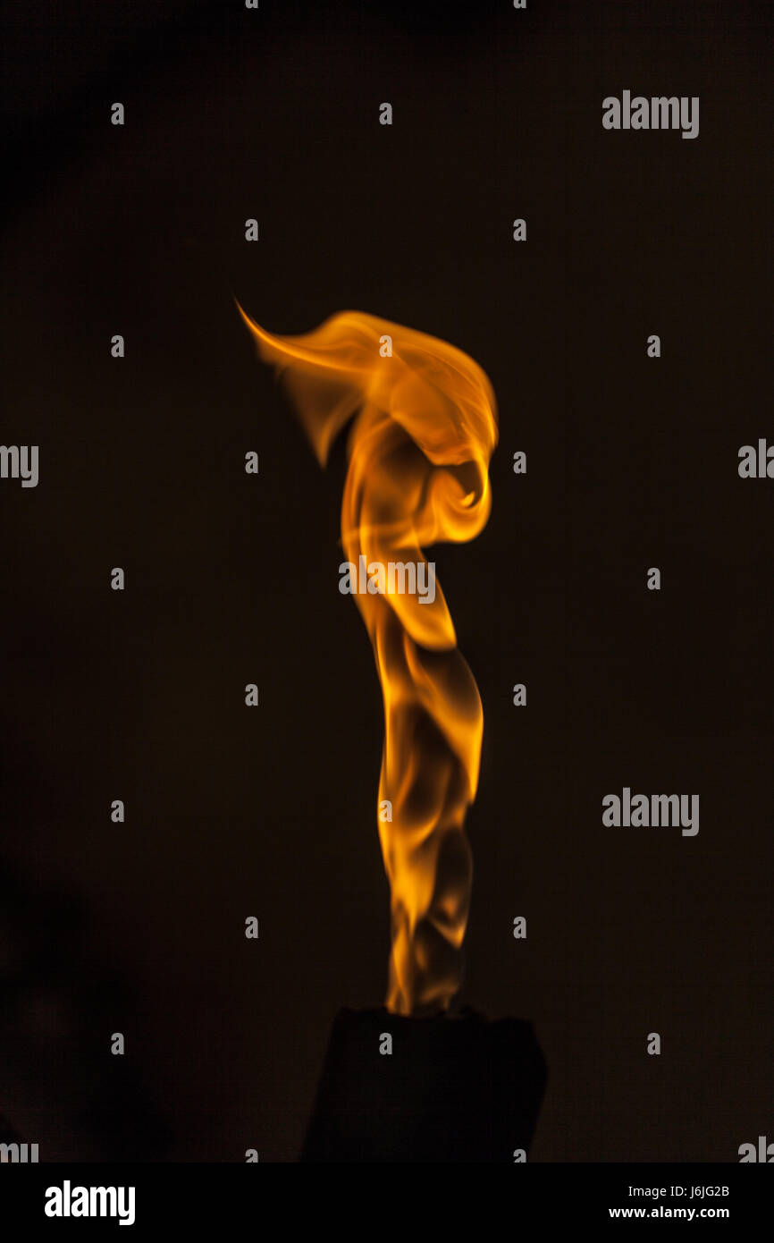 small burning flame on a black background Stock Photo