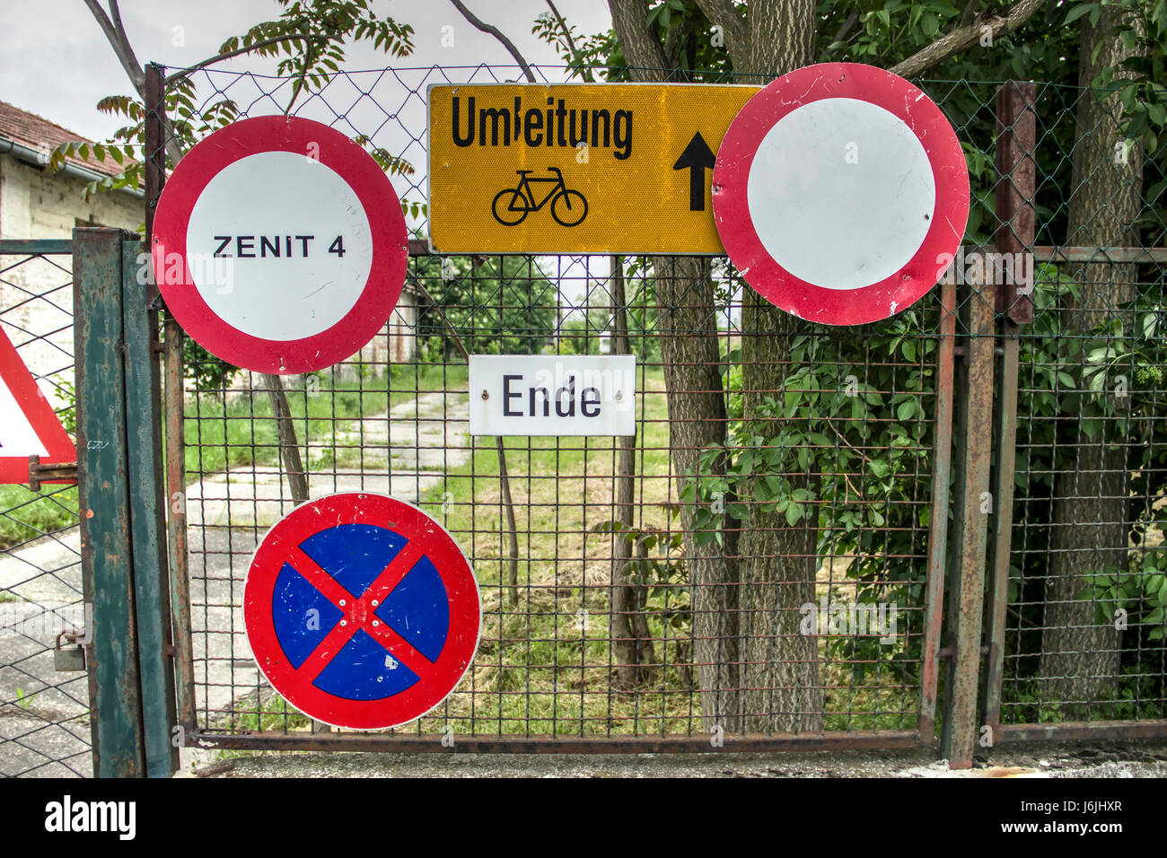 Serbia - Traffic signs on a wire fence Stock Photo