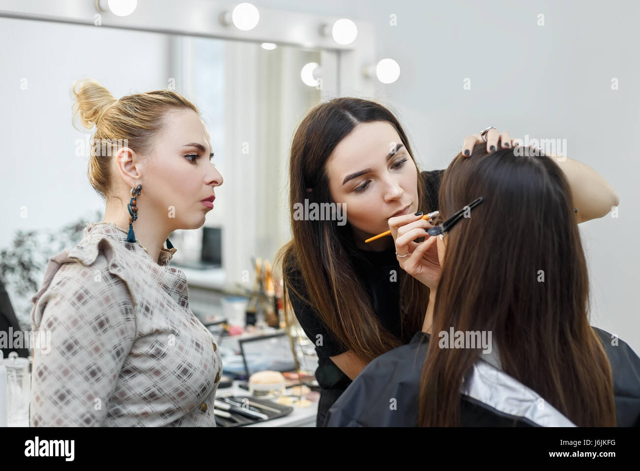 makeup teacher with her student girl. Makeup tutorial course at beauty ...