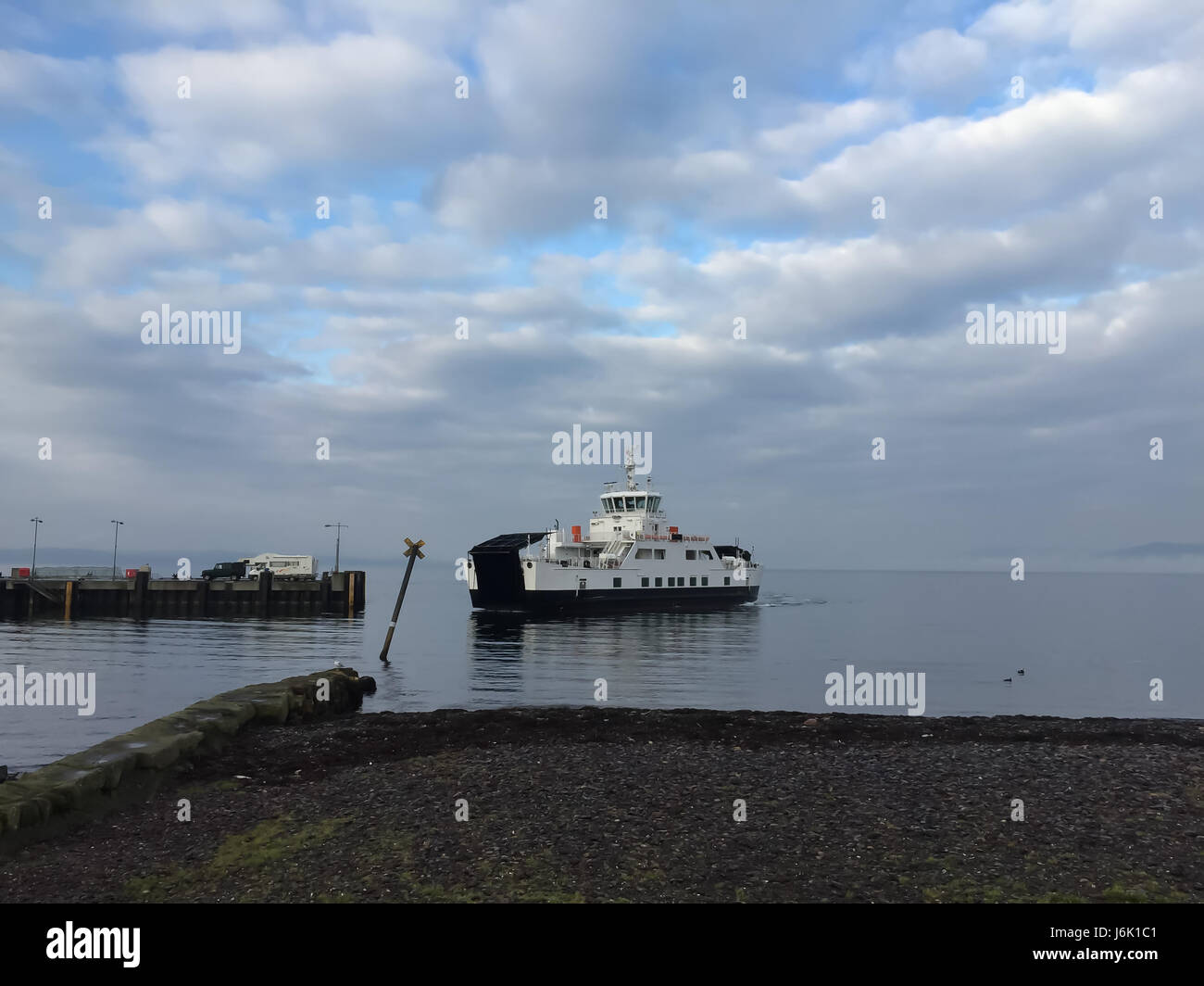 Small Scottish car ferry about to enter pier to unload cars Stock Photo Alamy