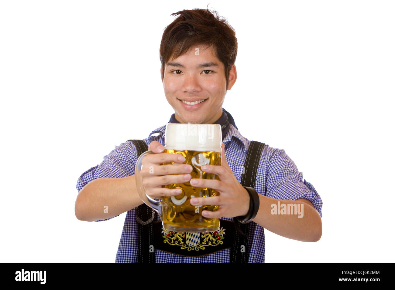 laughing asian holding a full oktoberfest beer stein (mass) Stock Photo