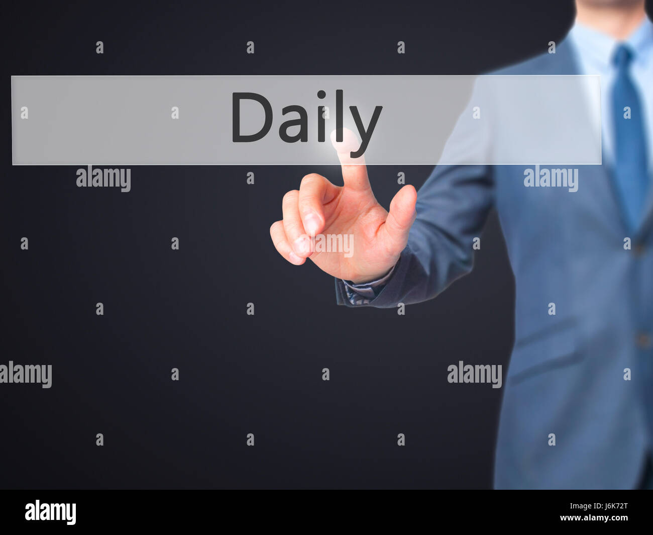 Daily - Businessman hand pushing button on touch screen. Business, technology, internet concept. Stock Image Stock Photo