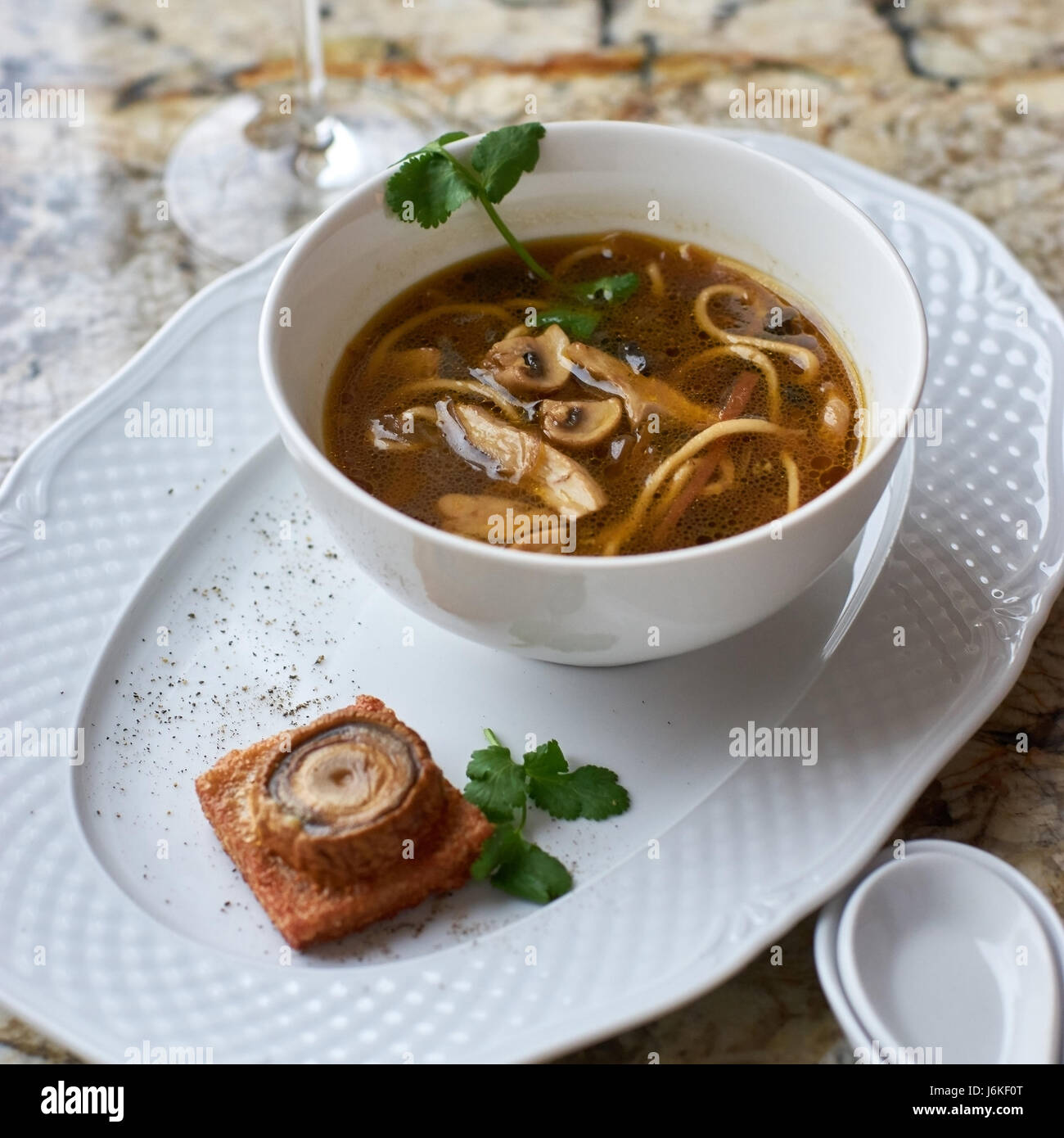 Mushroom soup with egg noodles Stock Photo Alamy