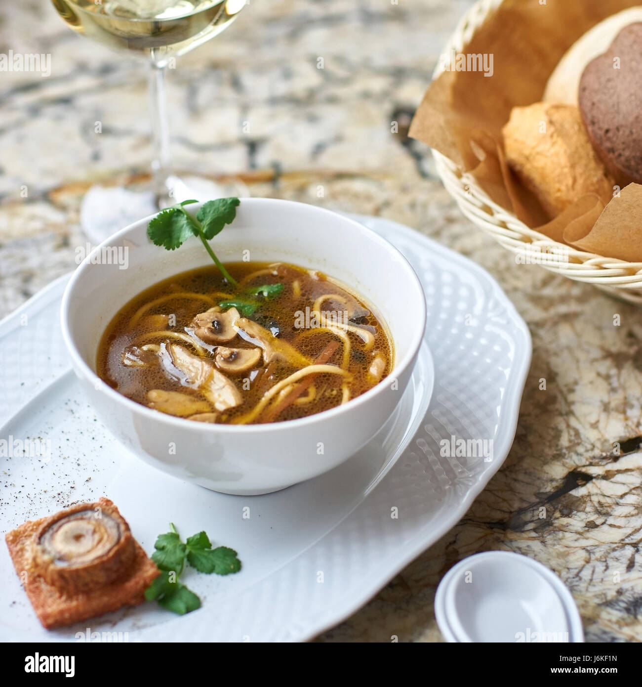 Mushroom soup with egg noodles Stock Photo Alamy