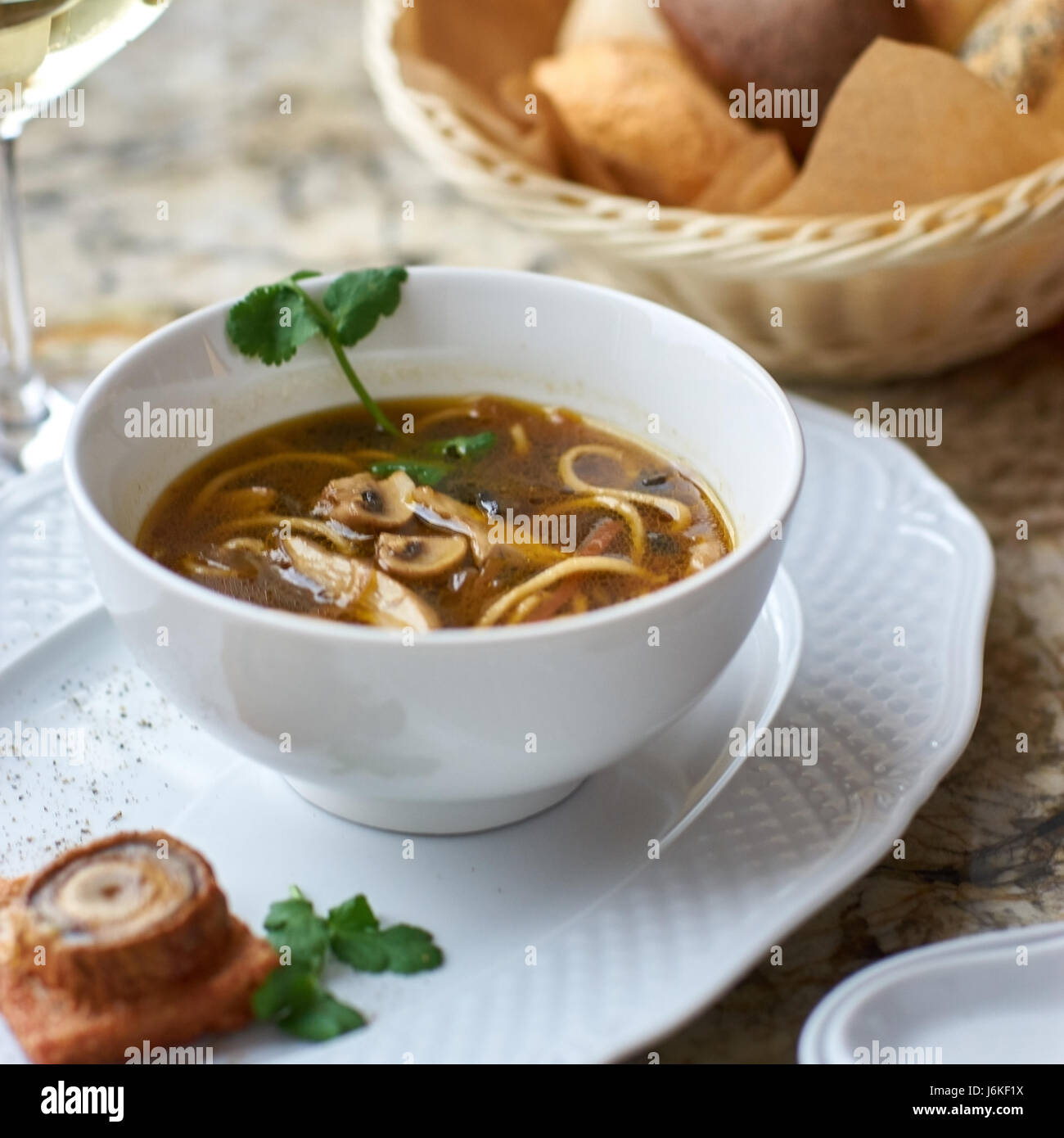 Mushroom soup with egg noodles Stock Photo - Alamy