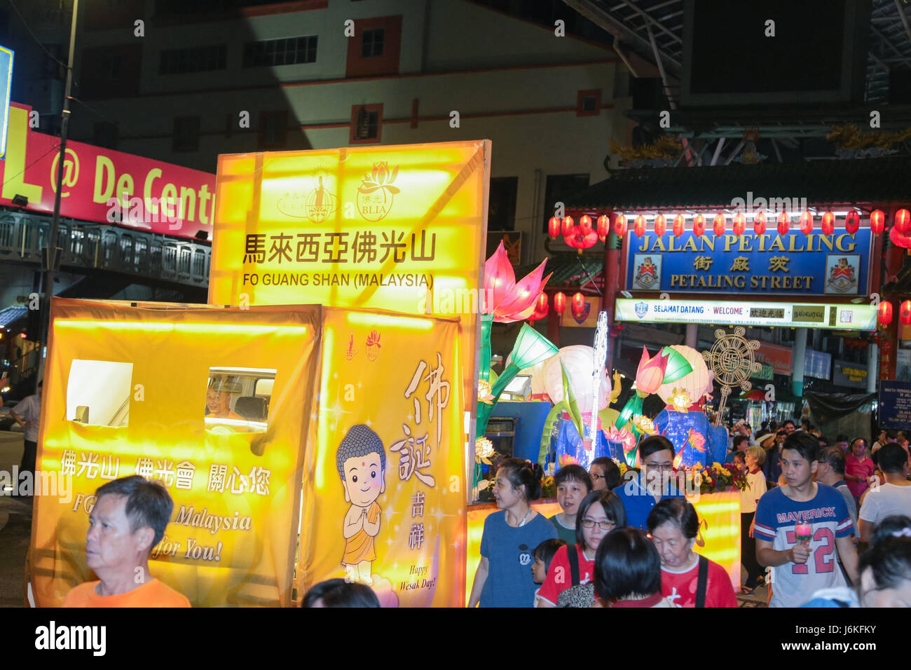 KL, MALAYSIA - 10 MAY 2017 : Wesak day procession floats owned by FGS group with its devotee crowd arrive in front the Petaling street Chinatown. Stock Photo