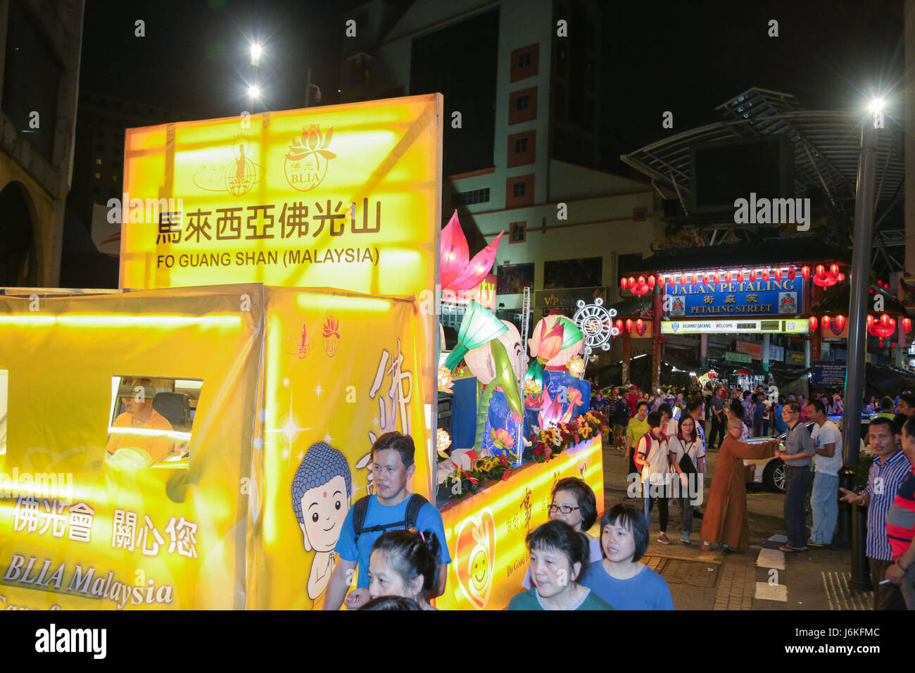 KL, MALAYSIA - 10 MAY 2017 : Wesak day procession floats owned by FGS group with its devotee crowd arrive in front the Petaling street Chinatown. Stock Photo