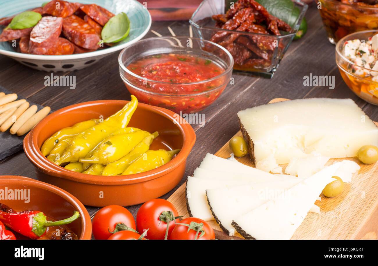 Mediterranean cuisine. Spanish tapas starters on wooden table ...