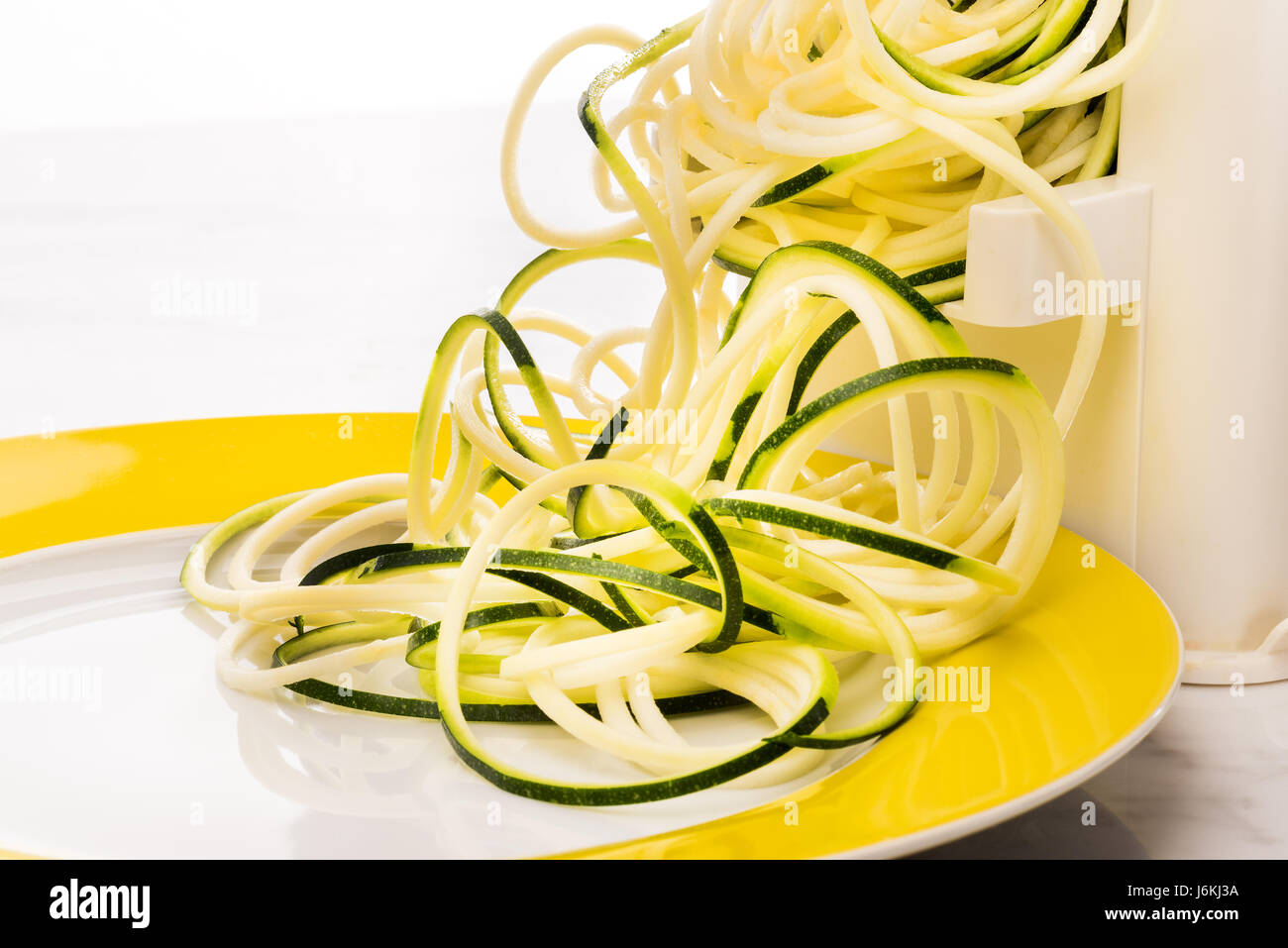 Zoodles making vegetable spaghetti zucchini pasta low carb Stock Photo
