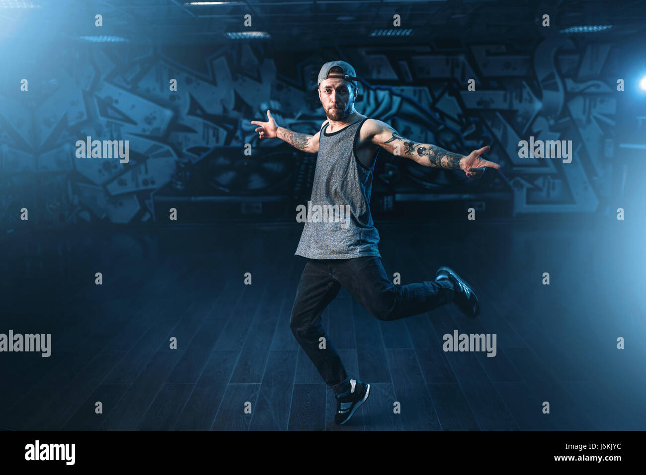 English Rapper Dancing Male rapper in dance studio, trendy lifestyle. Modern urban dancing ...