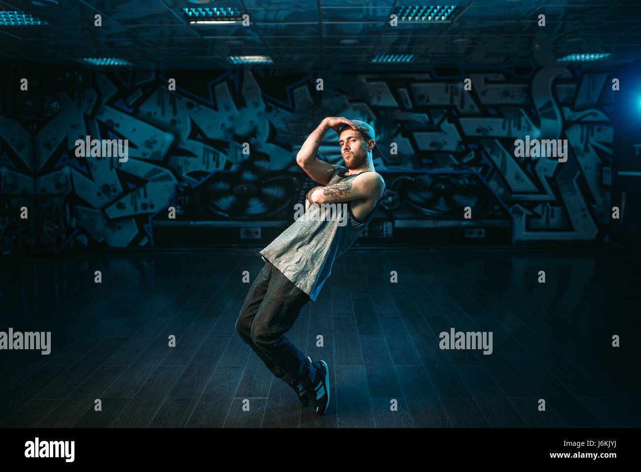 Male rapper in dance studio, rap performer. Modern urban dancing style ...
