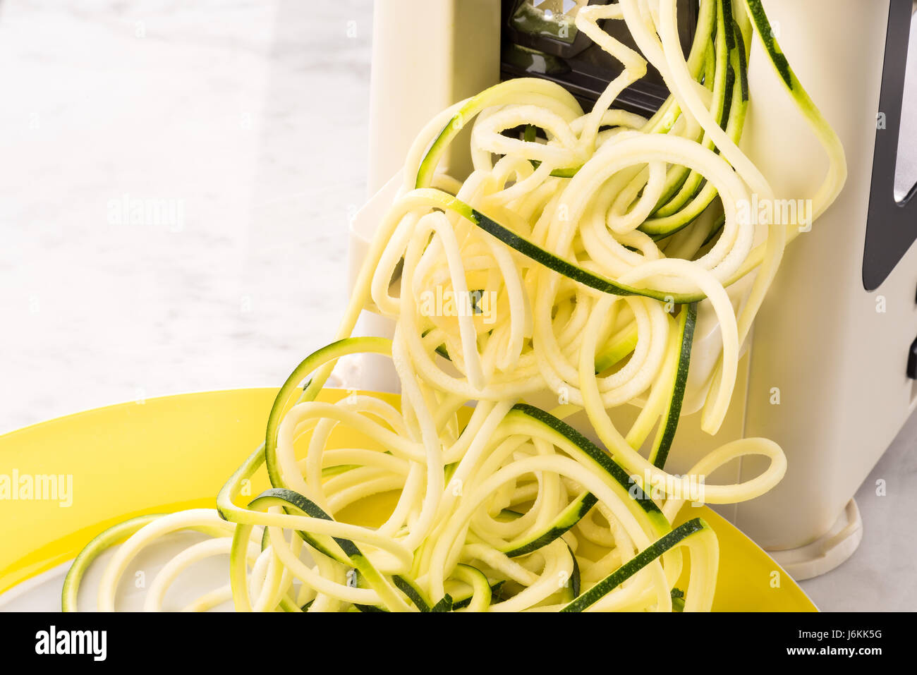 Zoodles making vegetable spaghetti zucchini pasta low carb Stock Photo