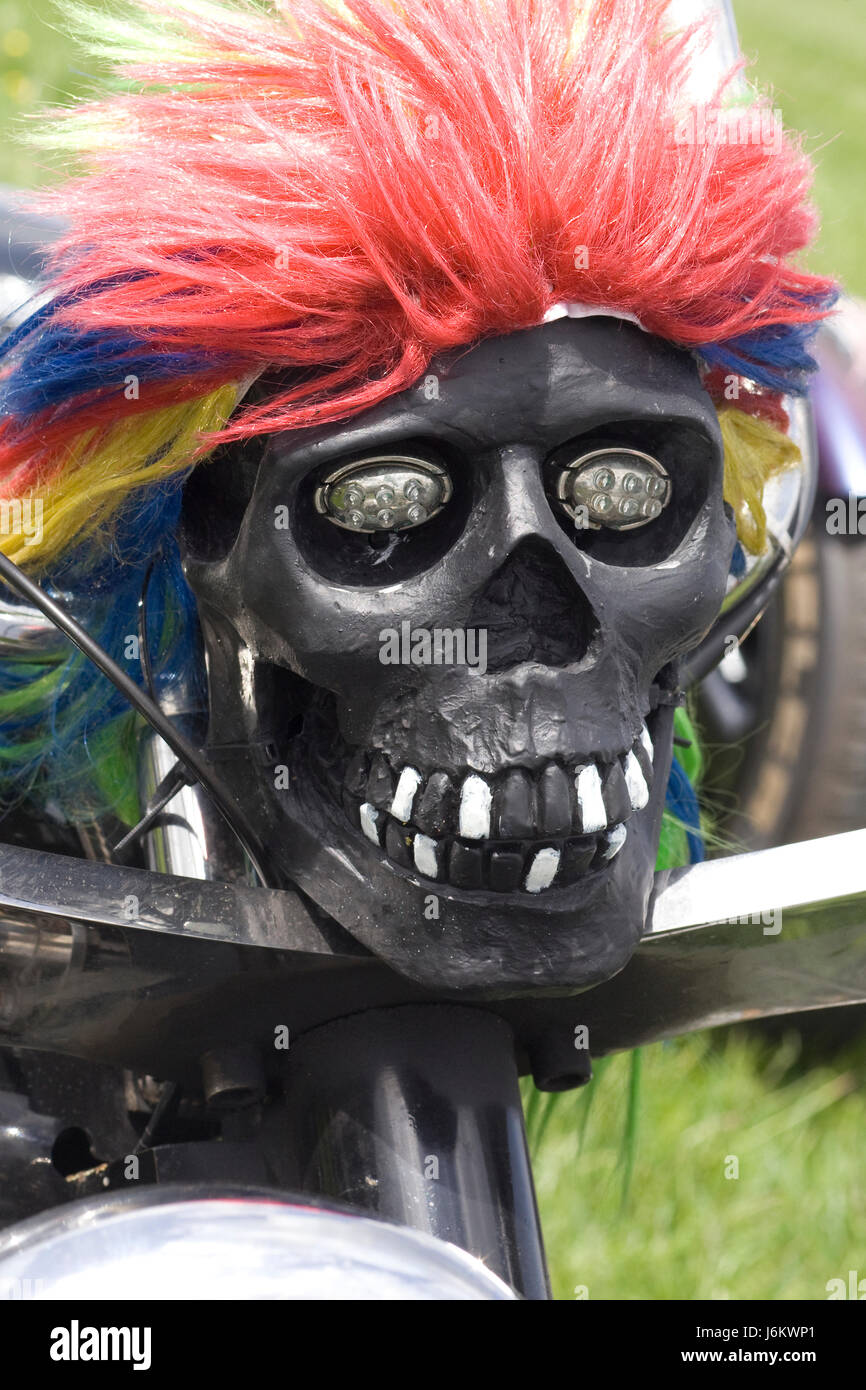 Troll coloured haired skull on a Motorcycle Stock Photo
